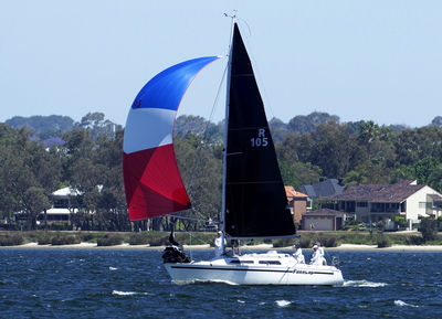 Farrlap running downwind under spinnaker